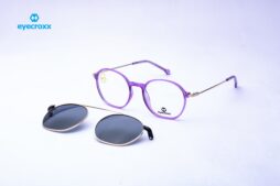 Unisex, purple transparent frame with gold metallic temples and purple tips. Gold tone metallic clip o
