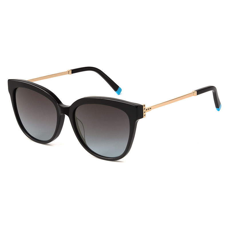 Shiny black, acetate, frame with metallic gold toned temples and matching color acetate temple tips.