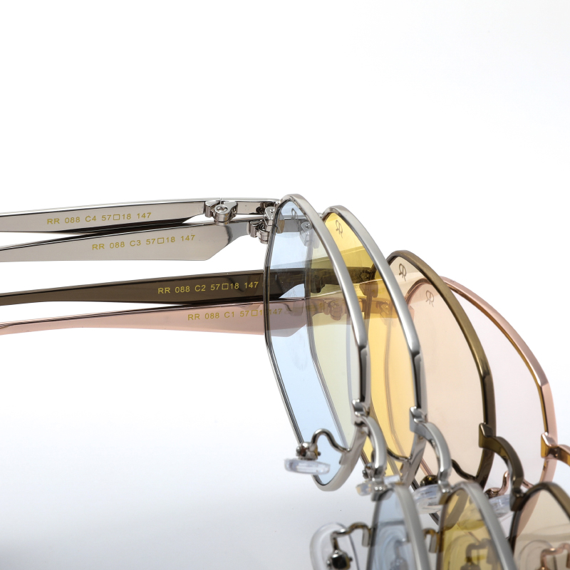 Trendy, mat dark gold tone, metallic frame and temples, with transparent light brown polarized lenses for 100% UV protection.