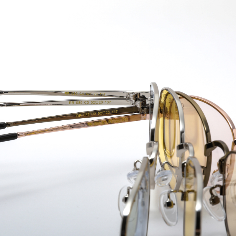 Trendy, mat dark gold tone, metallic frame and temples, with transparent light brown polarized lenses for 100% UV protection.